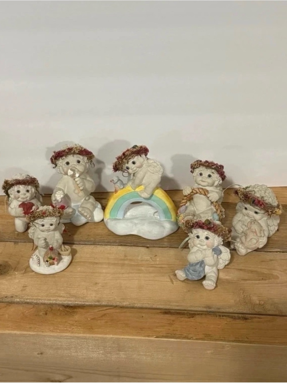 Whimsical White Angel Figurine Collection with Rainbow Accent